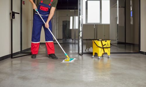 Cropped,Shot,Of,Janitor,Cleaning,Floor,With,Mop,Inside,Modern